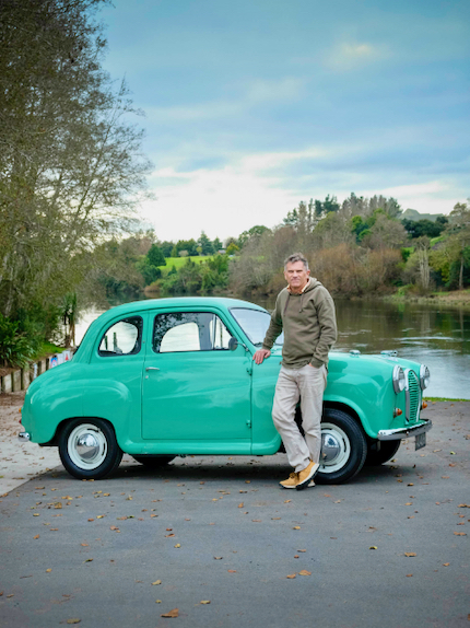 John MacFarlane stands in front of his green Austin A35.