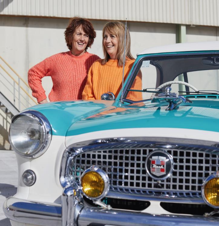 Twin sisters Vicki Turfrey and Sally Bridgeman with Sally's 1956 Nash Metropolit