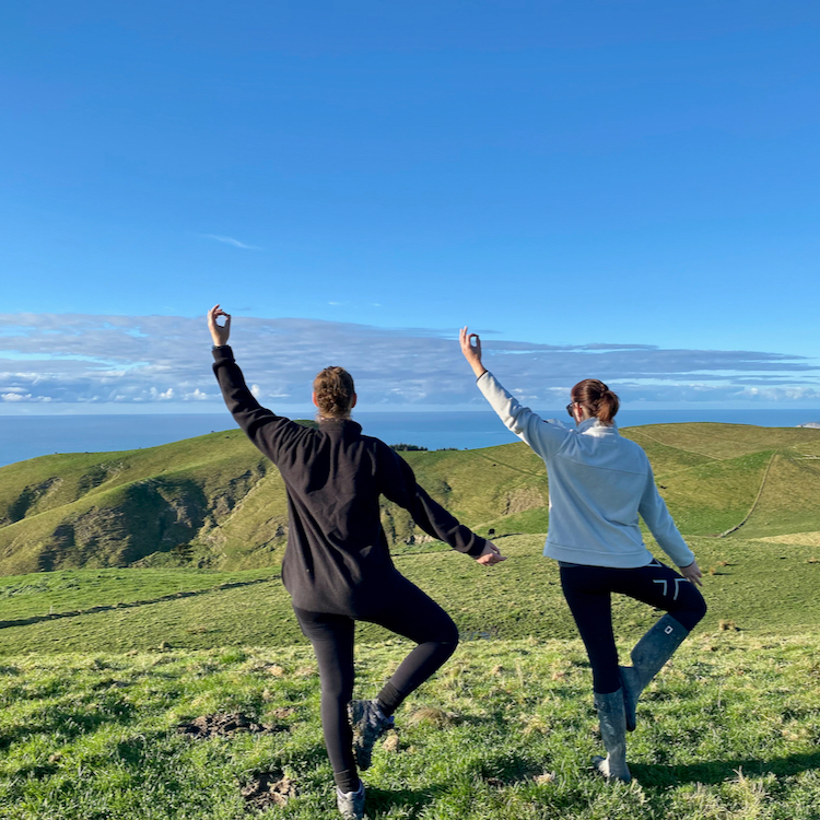 Yoga poses atop the Waipuka Hills at a Cape South retreat.