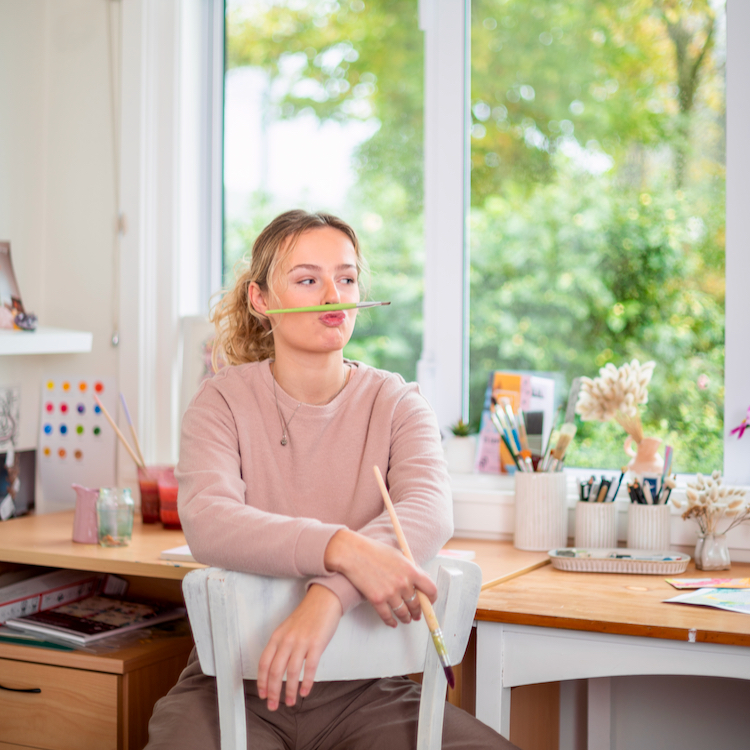 20-year-old Ella Ward creates colourful art in her studio.