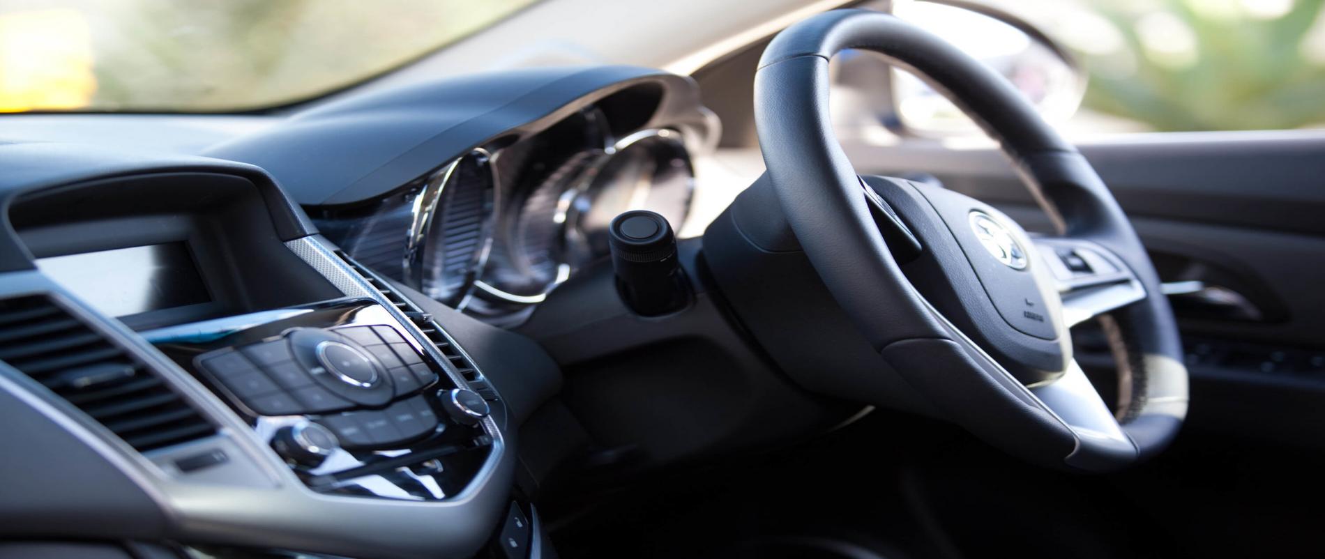 Sleek luxury car steering wheel.