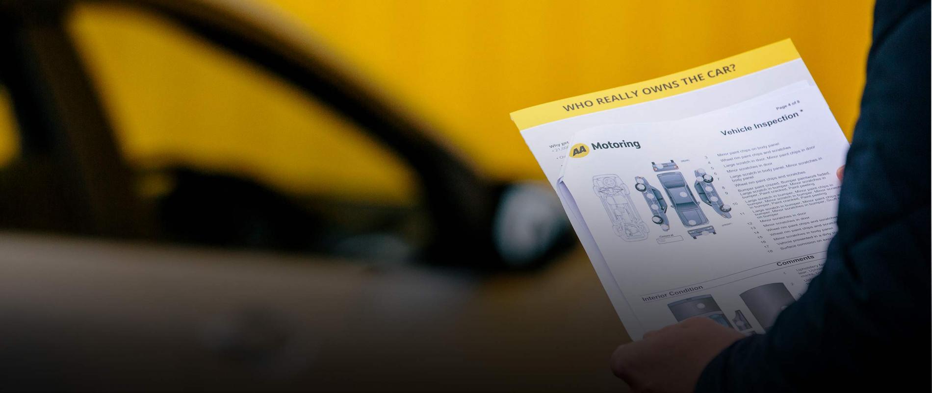 AA Motoring vehicle inspection document with a car in foreground