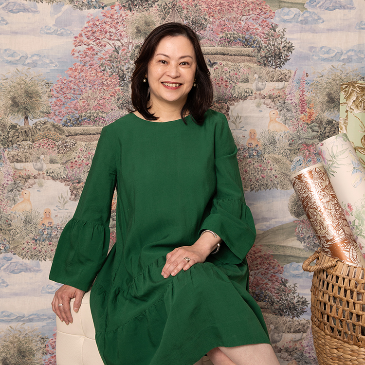 Maggie Lam with some of her beautifully designed wallpaper. Photo by Larnie Nicolson.